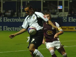 Dean Morgan in control of the ball