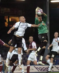 Jaroslaw Fojut looks to challenge the keeper