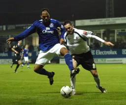 David Bell under pressure from Joleon Lescott