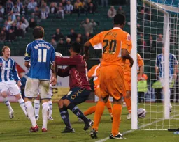 Calvin Andrew watches on as the goal is scored