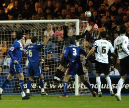 Chris Coyne and Matthew Spring watch the ball head towards goal