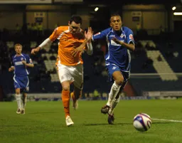David Bell in a foot race for the ball