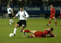 Steve Robinson goes around the grounded Forest player