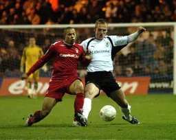 Jaroslaw Fojut battles for the ball