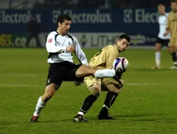 Steve Robinson controls the ball with an outstretched leg