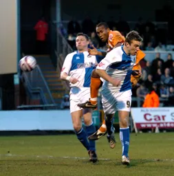 Calvin Andrew jumps for a header