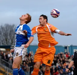 David Bell competes for a header