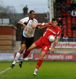 Calvin Andrew challenging for the ball