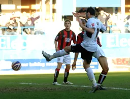David Bell challenging for the ball