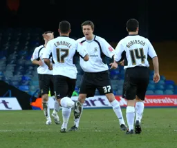 George Beavan celebrating with Lewis Emanuel and Steve Robinson