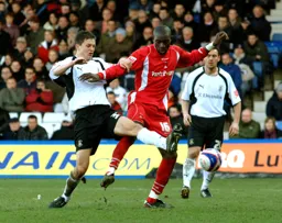 George Beavan challenges for the ball