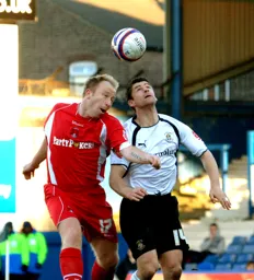 Steve Robinson trying to win the header