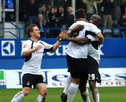 Lewis Emanuel celebrates his goal with Paul Furlong