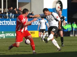 Lewis Emanuel fires in a shot