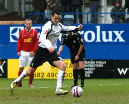 Matthew Spring about to net the winner from the spot