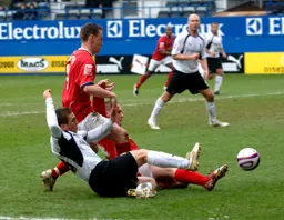 Paul McVeigh slides in as he attempts to cross the ball