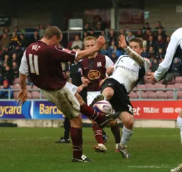 Paul McVeigh battles for the ball