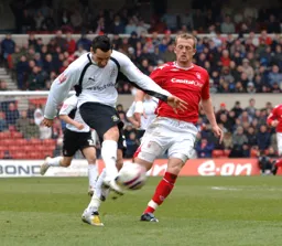 Matthew Spring puts his foot through the ball