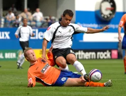 Lewis Emanuel being tackled