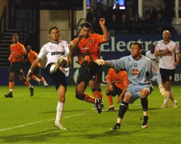 Rossi Jarvis tries to nick the ball over the goalkeeper