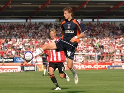 Rossi Jarvis controls the ball in midfield