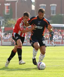 Lewis Emanuel gets forward with the ball