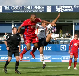 Lewis Emanuel tussles for the ball