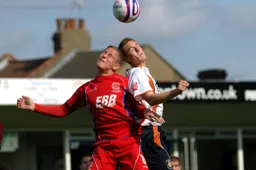 Asa Hall in an aerial duel with Lewis Chalmers