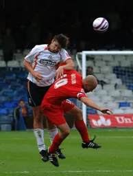 Ian Roper wins this aerial duel