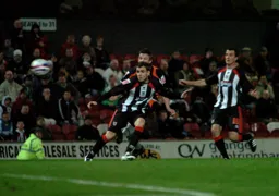 Tom Craddock curls in a magnificent equaliser in stoppage time