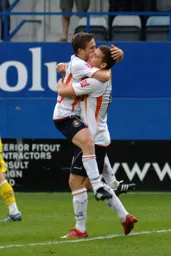 Paul McVeigh is congratulated after scoring the deciding goal