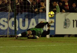 Conrad Logan dives to keep out a penalty in the shootout