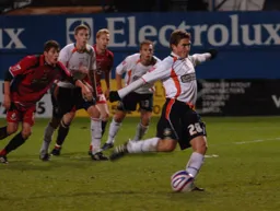 Paul McVeigh nets the late equaliser from the spot