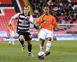 Ed Aasfu-Adjaye plays the ball forward