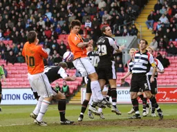 Ian Roper gets the ball away this time