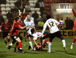 Mark Bower tries an overhead kick in a crowded penalty area