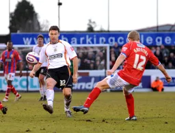 Kevin Gallen keeps his eyes on the ball