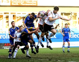 Chris Martin leads the charge of the heavy brigade