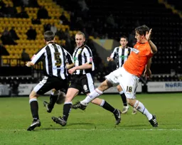 Chris Martin pokes the ball through