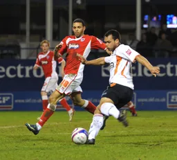 Lewis Emanuel clears the ball upfield