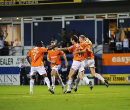 A happy bunch of Hatters congratulate George Pilkington after scoring his second goal