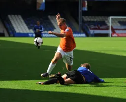 Jake Howells leaps over a Gateshead defender