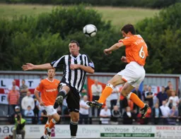 George Pilkington sends a header towards goal