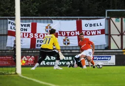 Kevin Gallen sends the ball across the face of the goal