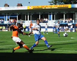 Adam Newton`s cross into the penalty area sailed into the net for the only goal of the game
