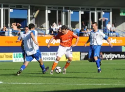 Kevin Gallen runs at a defender