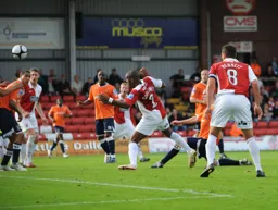 Asa Hall fires a shot over the bar