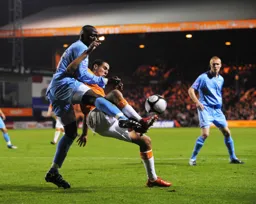 Ryan Charles and Djoumin Sangare contest for the ball