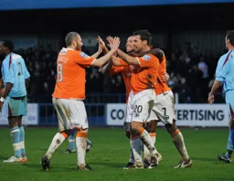 Kevin Nicholls and Keith Keane celebrate Town`s second goal with scorer Kevin Gallen