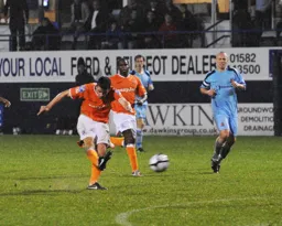 Tom Craddock hits a powefull shot to put Town 2-0 in front